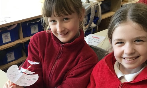 two children participating in the STEM challenge